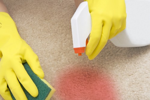 Carpet cleaning technician preparing equipment for a service booking