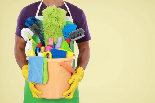 Cleaner treating a carpet as part of a scheduled cleaning appointment