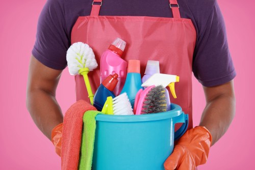 Technician using protective gloves and PPE during carpet cleaning