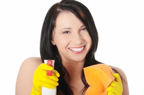 Carpet cleaning worker using protective gloves and safe products